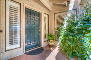 door of a house with flowers