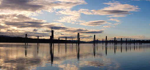 A panoramic photo of wood pilings in the Pend Oreille RIver in October in Cusick, Washington.