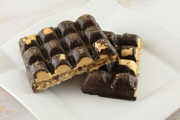 Chocolate covered wafer bars damaged by poor packaging and shipping 