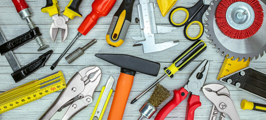 set of different hand tools on grey background top view