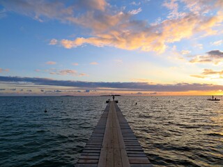 Wooden Pier Sunset at the Horizon