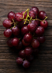 Red Globe set against a wooden background of old trees