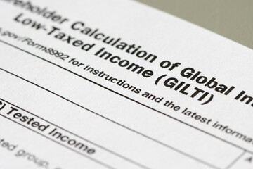Closeup of the title of Form 8992, U.S. Shareholder Calculation of Global Intangible Low-Taxed Income (GILTI). Selective focus on the word GILTI.