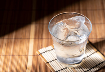 Shochu placed on a Japanese style wooden background.