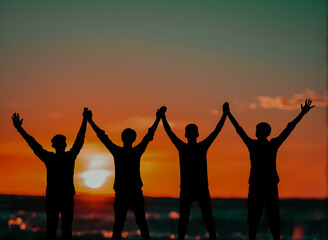 Fototapeta premium group of people at sunset