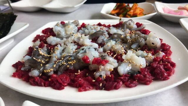 'Yukhoe Tangtang ee' is a Korean dish that with raw beef and live octopus.