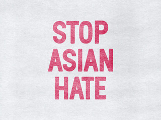 Stop Asian Hate - word on a grey textured background