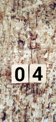 Number 04 on wooden blocks background. Stock photo.