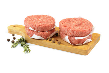 Raw beef patties for making a burger.Isolated on a white background.Selective Focus.