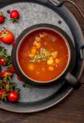 Homemade tomato soup with tomatoes, herbs, and spices. 
