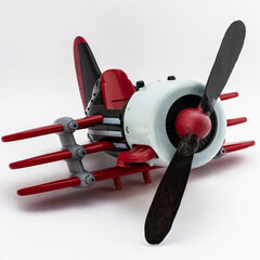 Toy airplane with a propeller on a white background, isolate.