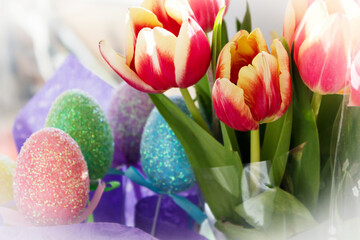 Colorful Easter eggs with tulips. Festive background.