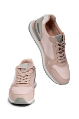 Light pink summer sneakers on a white background