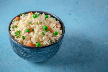 White rice with vegetables on a blue background
