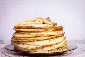 Appetite, delicious pancakes on a plate close-up.
