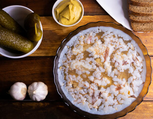 Traditional Russian meat aspic with mustard. Jellied meat.