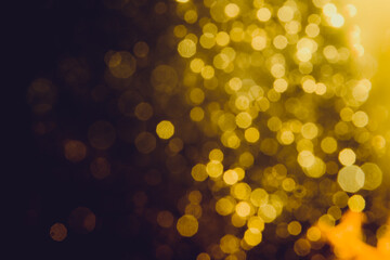 Abstract decorat  bokeh holiday christmas glowing lights on black