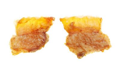 Fried lard cracklings on a white plate.