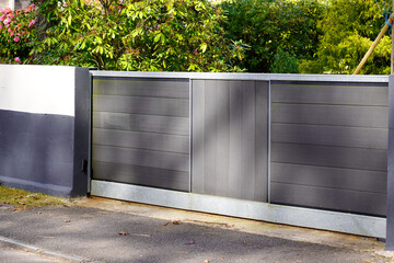 sliding portal grey aluminum and wooden door home gate of suburbs house in city