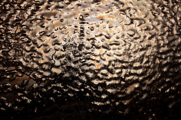 Ice on a black metal background.