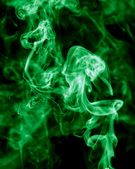 Fototapeta premium Green smoke isolated on black background. Abstraction