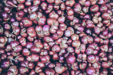 Red onions in plenty background texture