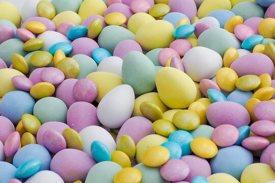 Lots of pastel colored Easter eggs chocolate, mini and small size, Spring image
