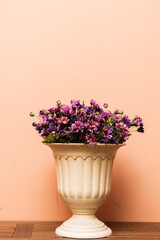 Close up flower in jar on wood,vintage background