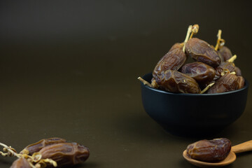 Kurma or Dates fruits, popular sunnah food in Ramadan month for breakfasting. Islamic background for text and template. Ramadan Kareem, Eid Mubarak celebration. 