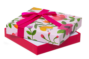 Gift box isolated. Close-up of a opened present or gift box with floral pattern and ribbon bow isolated on a white background. Birthday, valentine, anniversary or other holidays. Macro photograph.
