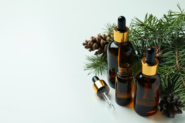 Aromatherapy concept with pine oil on white background