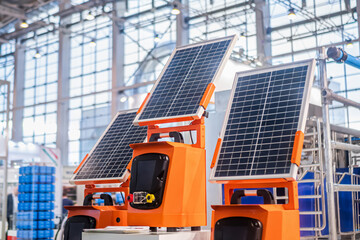 Automatic portable photovoltaic solar panels working at modern technology exhibition. Solar...