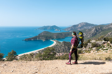 Hiker girl on the mountain top. Oludeniz, Turkey