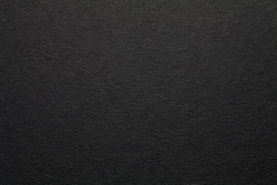 Sheet of black paper texture background