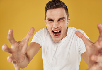 Emotional man gestures with his hands emotion model irritability stress