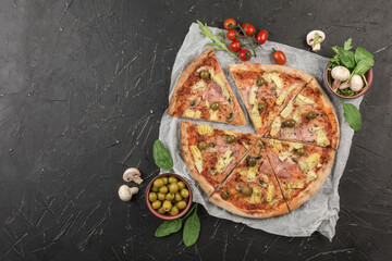 Pizza Margarita with olives, cherry tomatoes on a dark background. Classic Italian pizza.