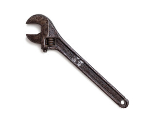 Old rusty adjustable wrench on white background