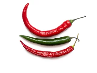 Fotobehang Red and green hot chili peppers on a white background © roundex