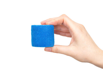 Girl holding a blue elastic fixing bandage in her hand on a white background, isolate. Close-up