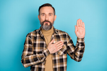 Fototapeta premium Photo portrait of aged man swearing giving promise serious isolated on bright blue color background