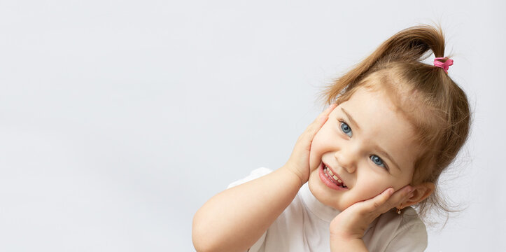 Portrait of a two year old girl isolated on white background