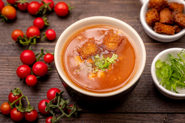 Homemade tomato soup with tomatoes, herbs and spices