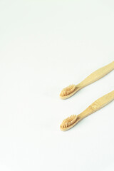 Two toothbrushes on a white background. Personal hygiene and self-care concept