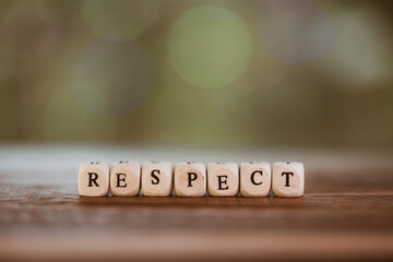 Words concept, RESPECT word cube on bokeh blur background ,English language learning concept.