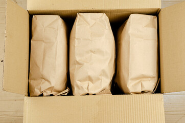 Ecological packaging and tare concept. Open cardboard box with p