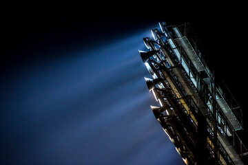 Lights at night. Spotlight illuminates the field at the sports stadium