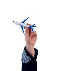 Man's arm raised holding a plastic airplane. Travel concept. Isolate on white background.