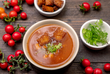 Homemade tomato soup with tomatoes, herbs and spices