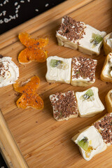 Japanese Sushi - Sweet sushi set on light wooden dish isolated on black background. Japanese food