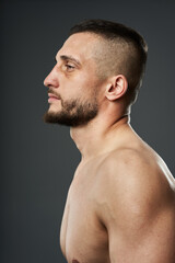 Naklejka premium Bruised fighter on gray background